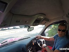 Red haired chick with tiny tits is having sex in the back of a taxi...