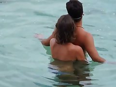 Lovely lady is pressing her natural boobs against her boyfriend s back...